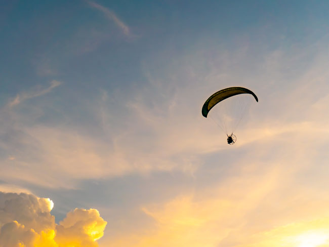 paraglider at sunset